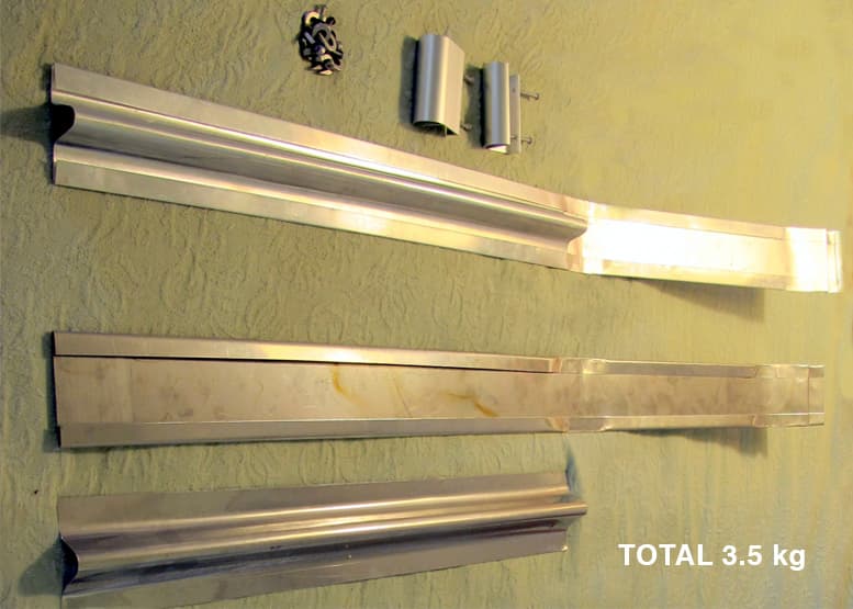 Pinpoint Solar folded sheet-metal rail parts and brackets arranged for inspection