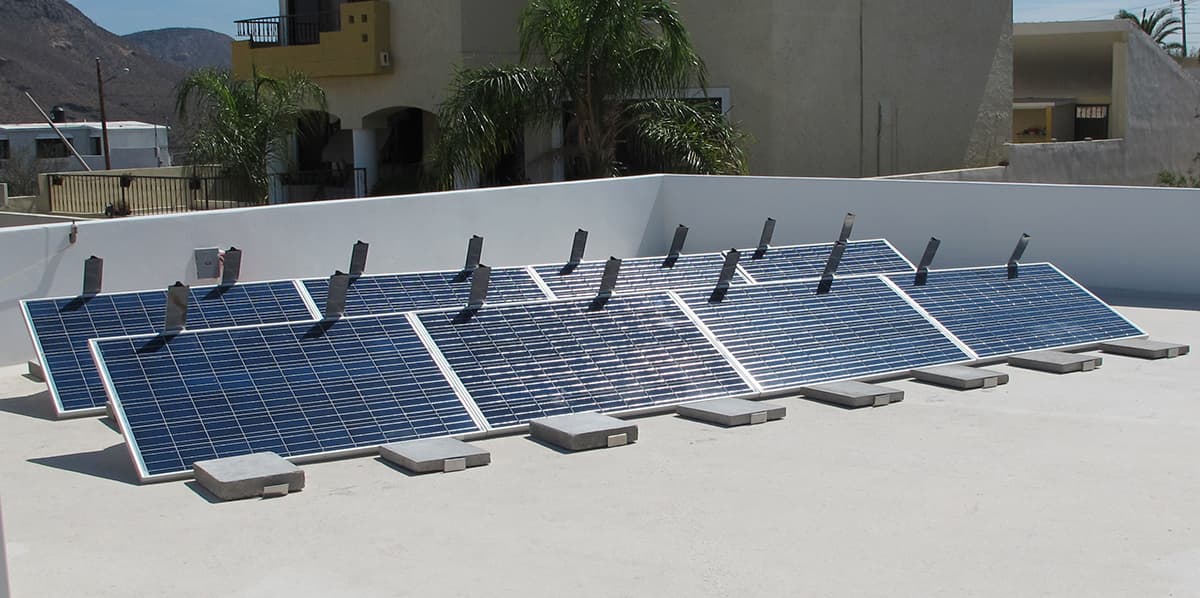 Pinpoint Solar ballasted mounting prototypes supporting photovoltaic modules on a flat roof